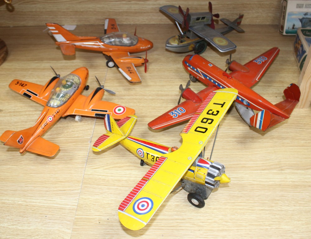 Two Joustin tinplate aircraft, Rallye and 3-147 and three other tinplate aircraft